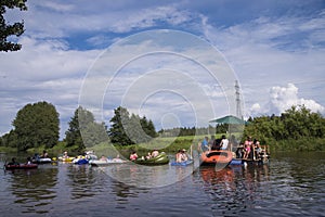 Unidentified people drafting down the river at the Kaljakellunta (Beer Floating) festival